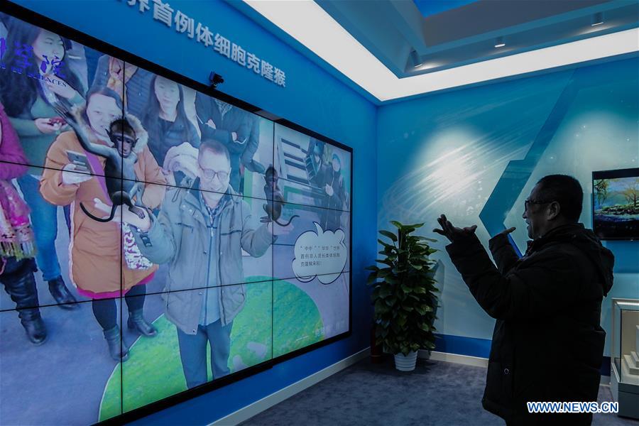 People visit exhibition commemorating China's reform and opening-up