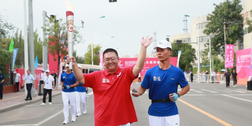 残运会火炬手王慧：心中的圣火永远照亮前进的道路