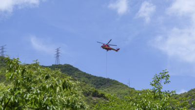 Implementation of 'Helicopter-UAV' Collaborative Aerial Hoisting Operations